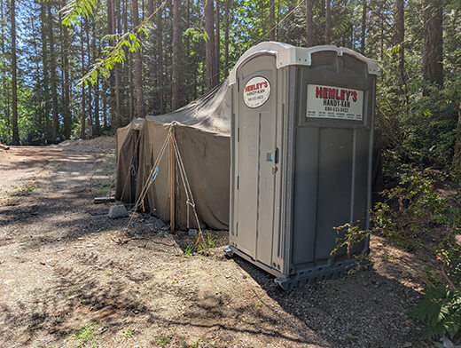 Portable Toilet Next to Tent in Lakebay WA